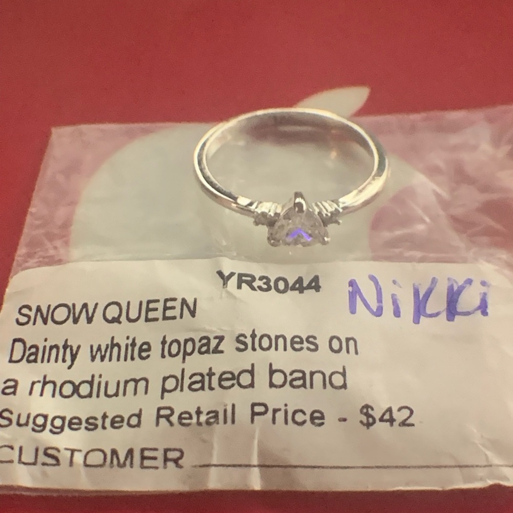 Size 8 white topaz stone on Rhodium plated band